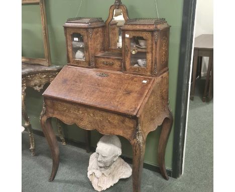 A 19th-century French inlaid walnut ladies' bureau. 