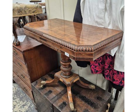 A regency fold-over card table. 