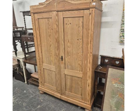 A pine wardrobe. H 197 x W 122 x D 48cm