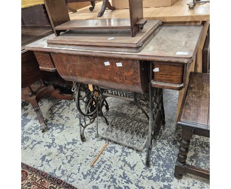 A Singer treadle sewing machine. 