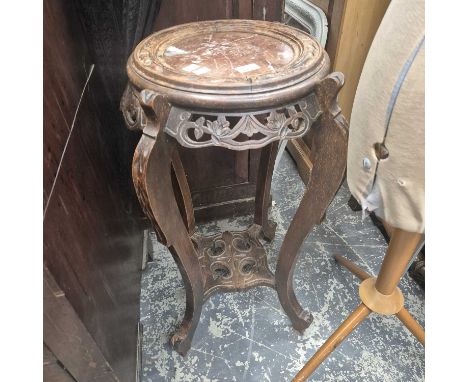 An oriental plant stand.