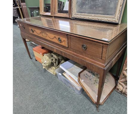 An antique square piano converted into a sideboard. 