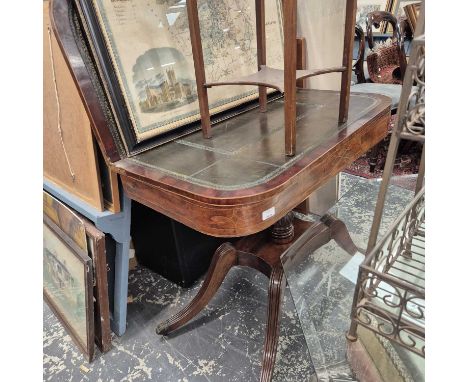 A regency mahogany fold-over card table. 