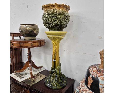 A Bretby pottery jardiniere stand and an associated planter. 