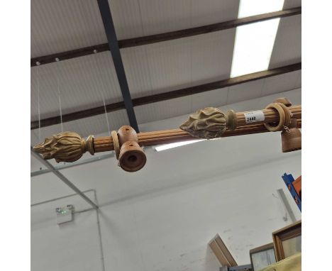 Two curtain poles. 