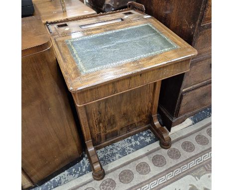 A Victorian walnut Davenport desk. 