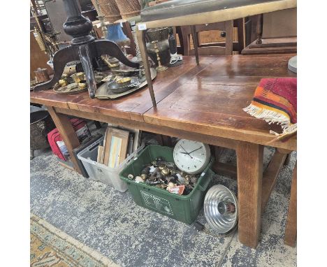 A large hardwood extending table and six ladder-back chairs. 