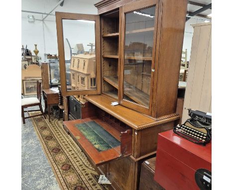 A Victorian oak secretaire bookcase. 