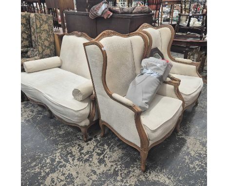 A pair of French-style show-frame wing arm chairs and a similar settee. 