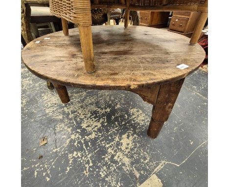 An antique low cricket table. 