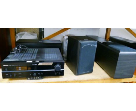 A Yamaha amplifier, together with 5 speakers to create a surround sound system