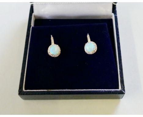 A stirling silver pair of opal and cubic zirconia earrings