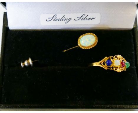 A silver gilt opal pin brooch and a lapis opal garnet and emerald set ring