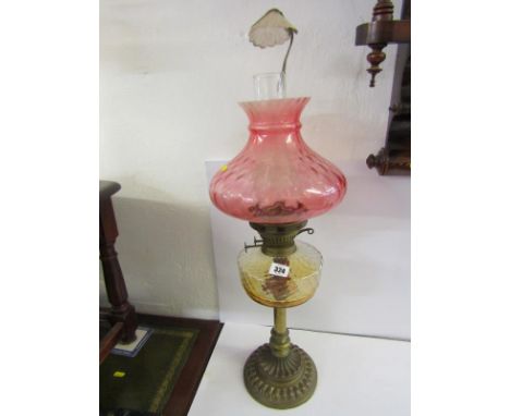 OIL LAMP, brass circular fluted base oil lamp with dimpled reservoir and pink glass shade 
