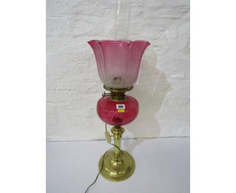 ANTIQUE OIL LAMP, brass circular based plain column support oil lamp with writhen design cranberry reservoir and floral etche