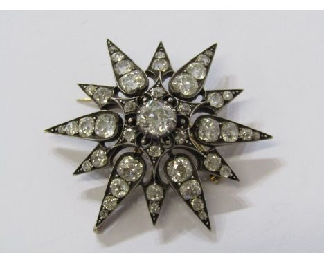 SPECTACULAR VINTAGE GOLD &amp; SILVER MOUNTED DIAMOND STAR PENDANT, principal old cut diamond of approximately 1ct surrounded