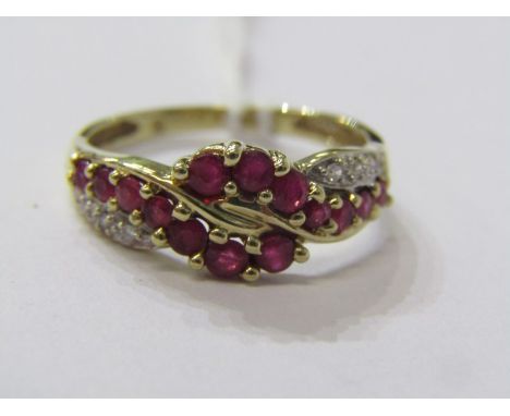 9CT YELLOW GOLD RUBY &amp; DIAMOND HALF ETERNITY STYLE RING, unusual bypass design, graduated rubies set with accent linkup d