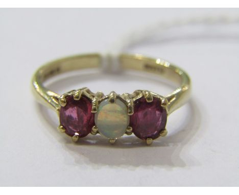 9CT YELLOW GOLD 3 STONE OPAL &amp; RUBY RING, principal oval cut opal with good colour ruby to each shoulder in 9ct yellow go