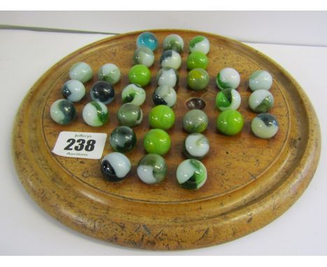 ANTIQUE SOLITAIRE, circular based fruitwood board with vintage marbles 
