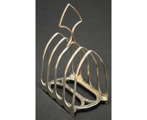 A Victorian silver four division toast rack, hallmarked London 1888, makers mark Edward Hutton. 5.1 ozt.