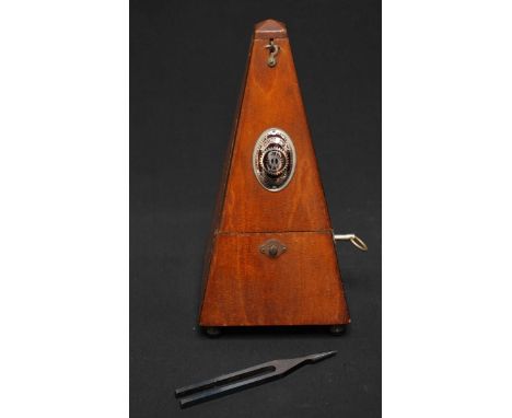 A German mahogany metronome, together with a tuning fork.