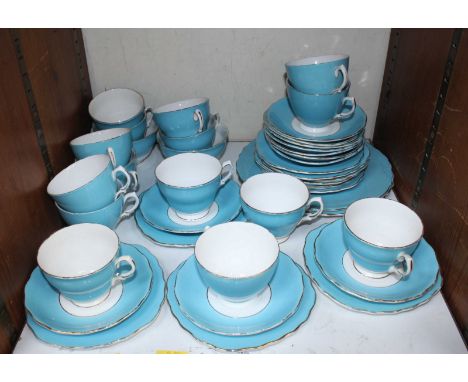 SECTION 27 - A sky blue and gilt tea service including some pieces by 'Colclough' comprising of teacups, saucers and side pla