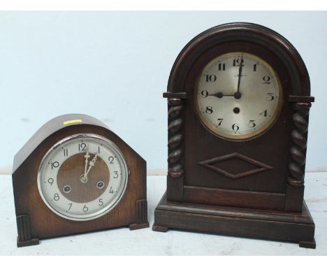 A large 1930s oak dome topped mantel clock, together with a small 1930s oak mantel clock. (2)