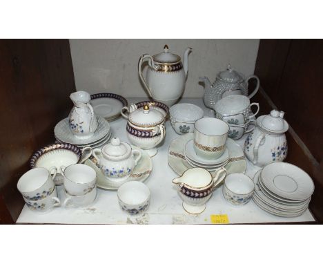 SECTION 19. A shelf of assorted tea sets, including a Wedgwood blue, white and gilt set, a lustre set, and an unmarked set.