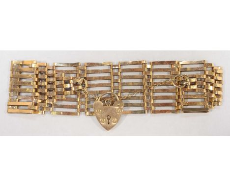 A 9ct gold eight bar gate bracelet, with heart shaped padlock clasp. 16.6 grams.