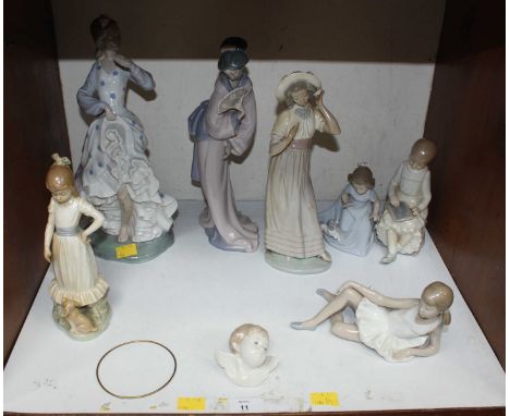 SECTION 4. A collection of seven Nao porcelain figures, and a Lladro cherubs head. (some as found)