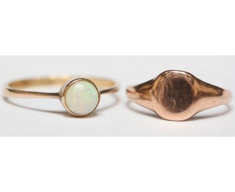 A 9ct gold and opal single stone ring, and a 9ct gold signet ring. 3.2 grams total. (2)