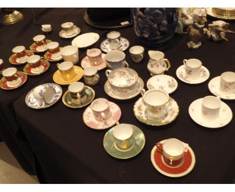 Mixed coffee cans and saucers including Wedgwood and Minton 