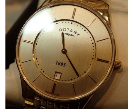 Boxed new old stock gents gold tone Rotary wristwatch with date and matching strap  CONDITION REPORT: This item is working at