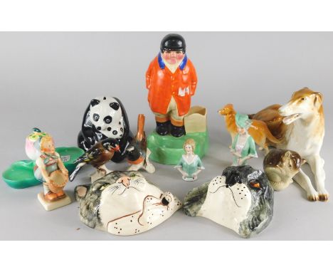 A collection of decorative animal ornaments, to include Goebel birds, Hummel figure, Tom Raymond cat mask, Handley Cross adve
