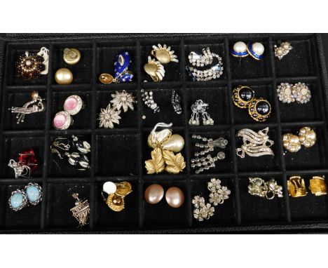 A quantity of vintage clip-on earrings, of varying designs, some stone set, some with enamel work (in fitted case)