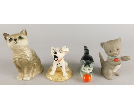 A collection of ceramic figures, to include a Royal Doulton tabby cat, a Royal Doulton 101 Dalmatians figure Penny Yawning, a