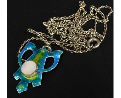 A silver and enamel pendant and chain, the pendant in the Art Nouveau style, with moonstone centre, and blue and green enamel