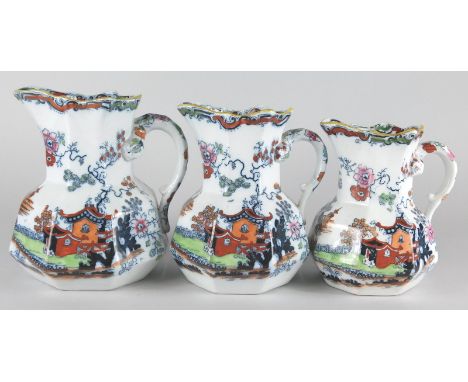 A set of three Ashworth Bros Ironstone hydra type jugs, each decorated with oriental landscapes etc., printed marks to unders