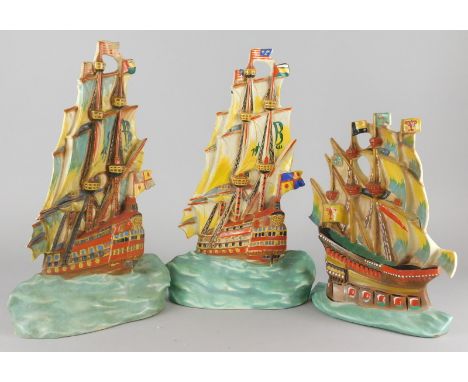 Three similar Art Deco Czechoslovakian pottery ornaments, each modelled in the form of a galleon, printed mark in red to unde