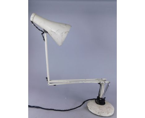 A cream painted angle poise desk lamp