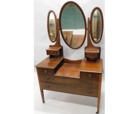 An Edwardian mahogany and chequer banded dressing table, with three oval bevelled mirror plates, two trinket drawers and a st