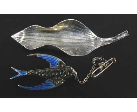 Two Scandinavian silver brooches, to include a Scandinavian leaf shaped brooch, marked Sterling Denmark, and a silver enamel 