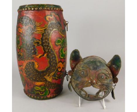 Tribal Art.  An Eastern drum, painted with dragons etc., and a metal wall mask depicting a cat
