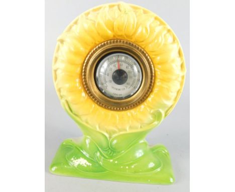 A Foley Faience desk thermometer, the case modelled in the form of a sunflower, printed mark in brown to underside, 16cm high