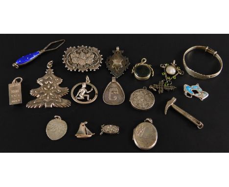 A quantity of silver and other pendants and fobs, to include an enamel pendant, silver brooch, a silver bangle, a hammer pend