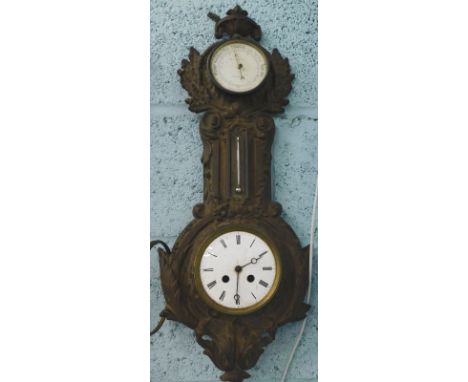 A late 19thC French cast iron clock and aneroid barometer, the case decorated with leaves etc. (AF), 65cm high