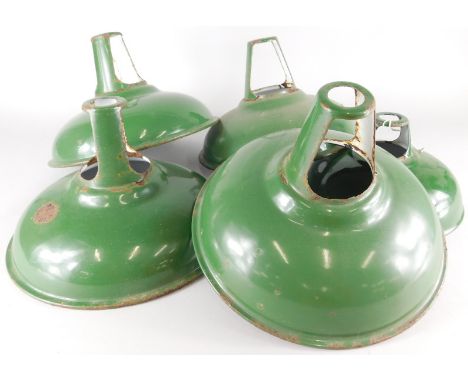 Four green enamel industrial style light shades, and another similar