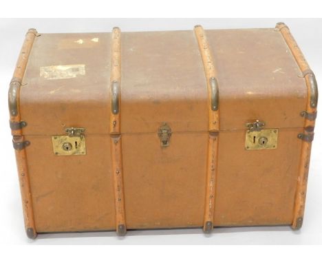 A wooden bound canvas trunk, with railway related labels etc.