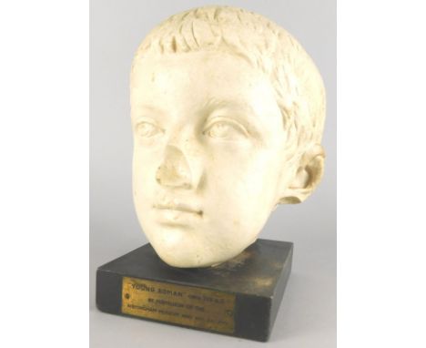 A composition Roman style figure of a child, on a rectangular ebonised base, the plaque inscribed Young Roman circa 225AD by 