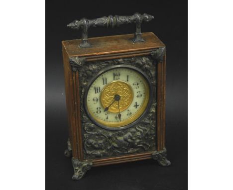 A late 19th/early 20thC French carriage type clock in mahogany case, embellished in silver plated metal, cast with putti etc.